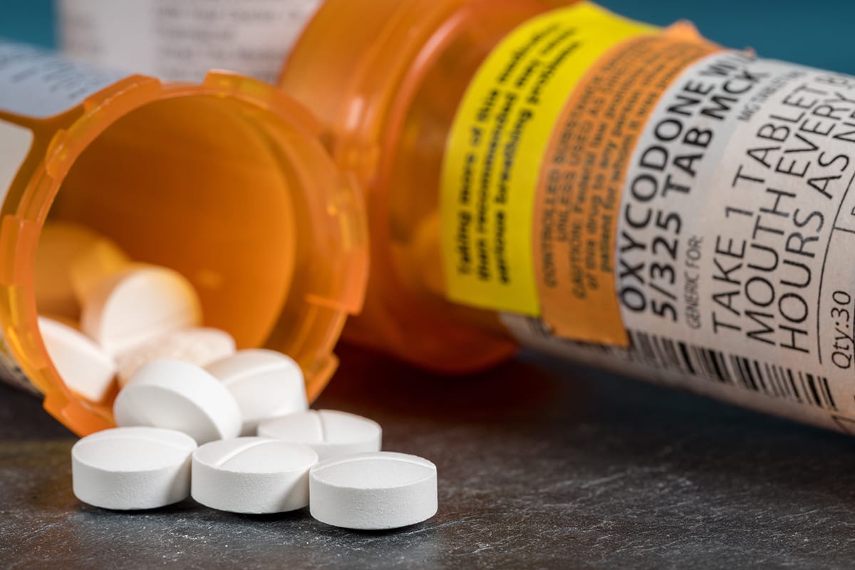 overturned bottle of pills makes people wonder about opioids vs. opiates