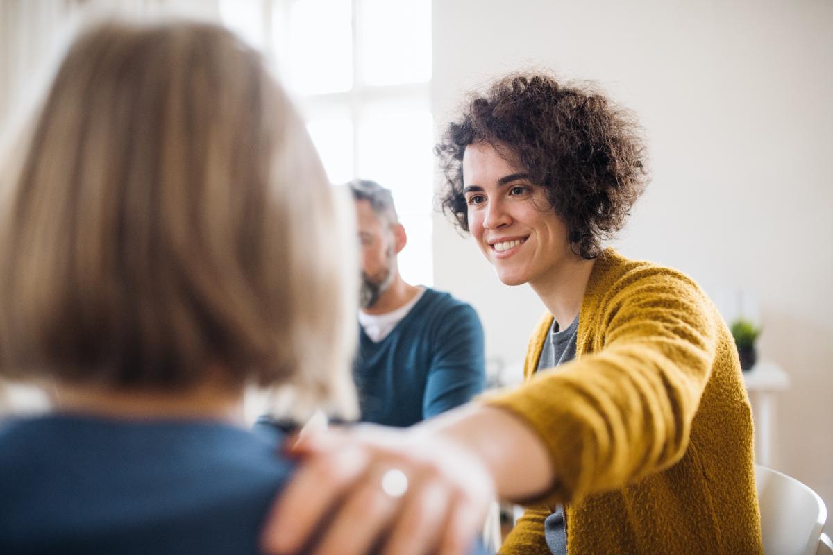 a woman is happy to be a part of a colorado suboxone clinic