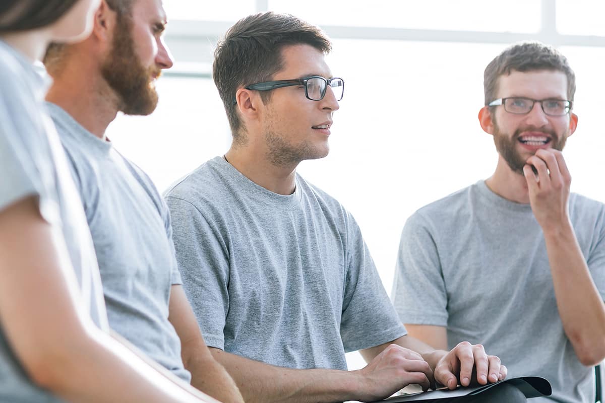 men at a counseling center