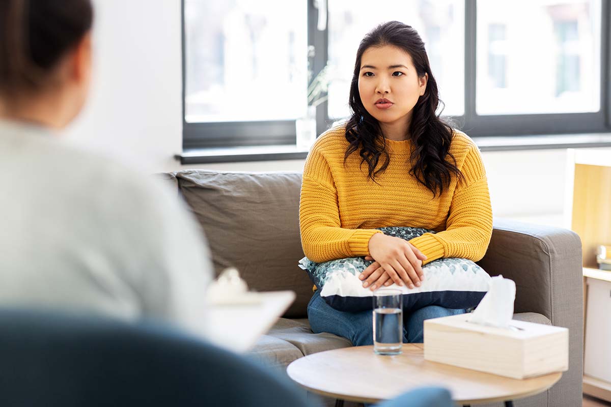 woman talking about dual diagnosis treatment at a recovery center