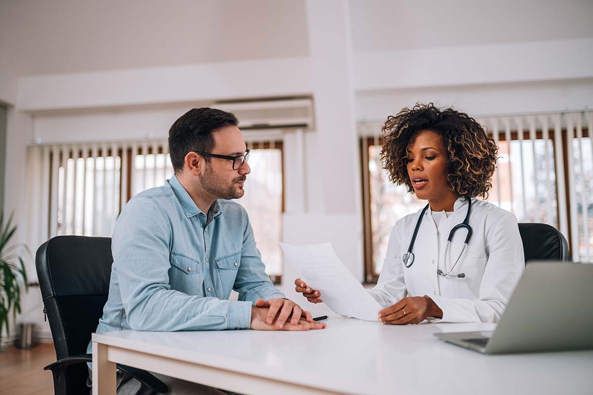 doctor and patient talking about outpatient treatment program benefits