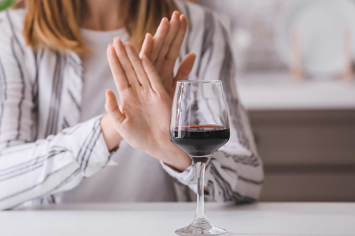a woman uses what she learns in alcohol addiction therapy