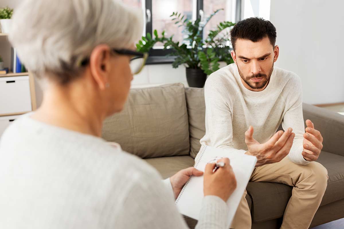 a man struggling with addiction uses CBT to cope