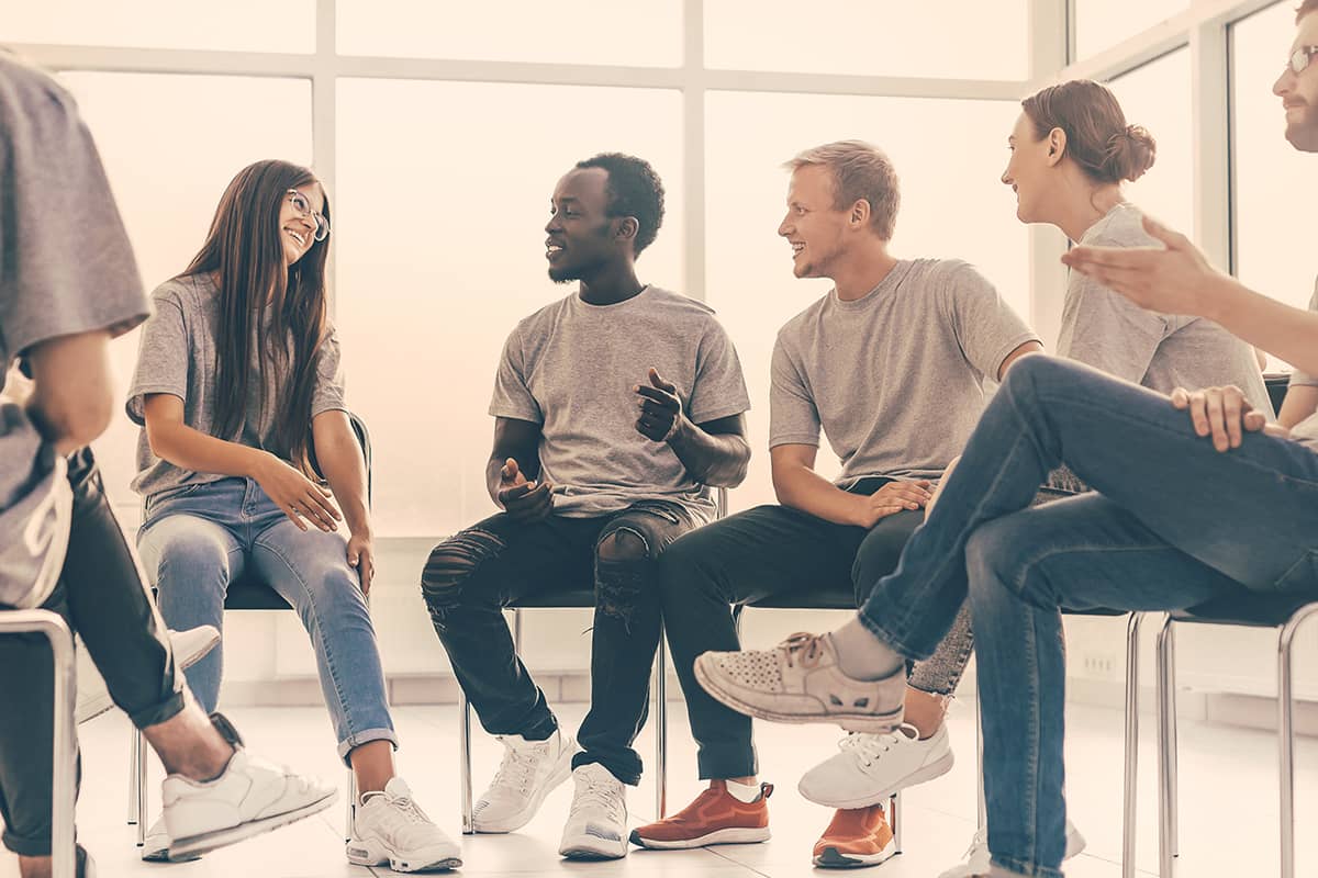 Adults Discussing Stages of Addiction Recovery