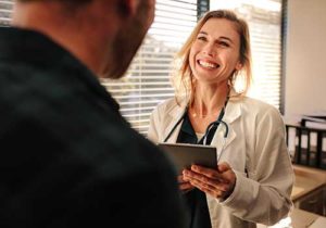 a doctor at an outpatient detox center discusses the benefits of attending an outpatient detox program using medication-assisted treatment at a drug and alcohol detox center