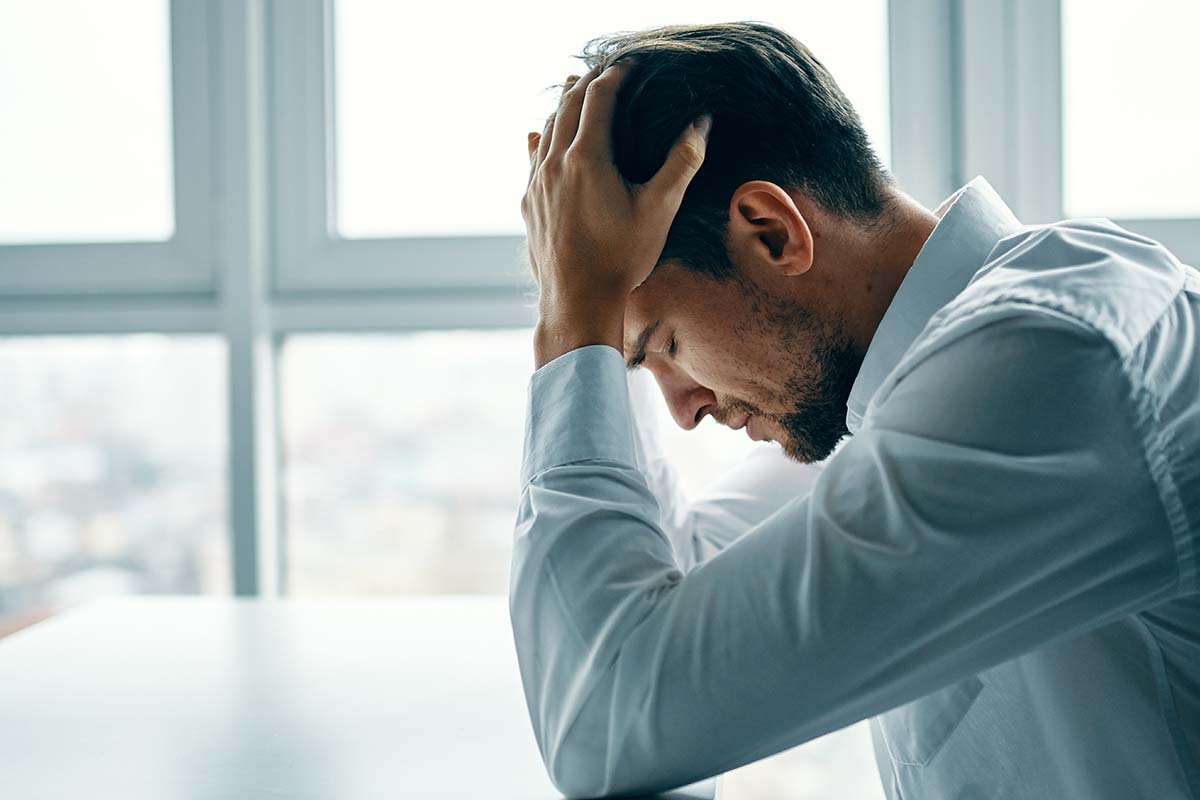 a man struggles with the symptoms of oxycontin addiction